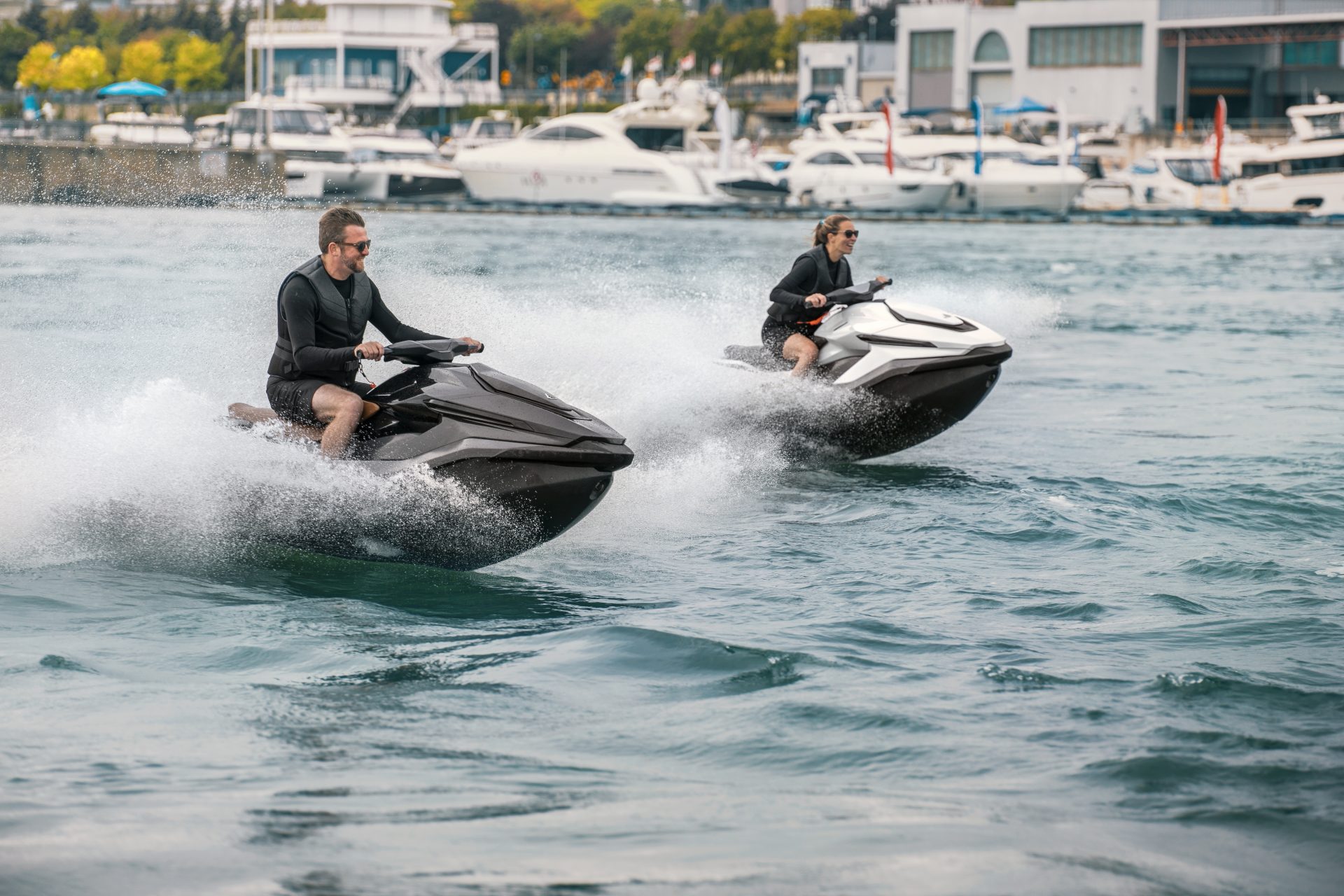 Two Taiga Orca PWCs racing on the water